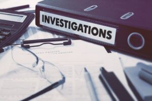investigator’s desk with binder on it